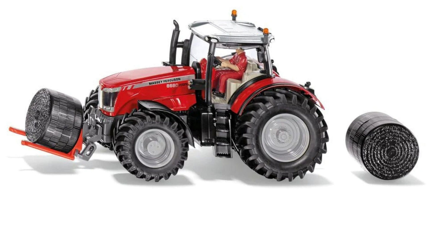 Massey Ferguson MF8680 Traktor mit Ballentransportgabel und 2 Rundballen - siku